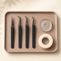 Soft Reason precision lash tweezers on cream background